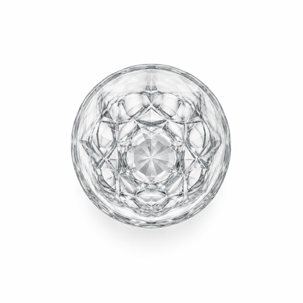 Clear drinking glass viewed from above, showing a geometric pattern and starburst base