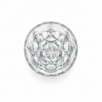 Clear drinking glass viewed from above, showing a geometric pattern and starburst base
