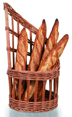 Wicker bread basket with raised back holding tall loaves of bread