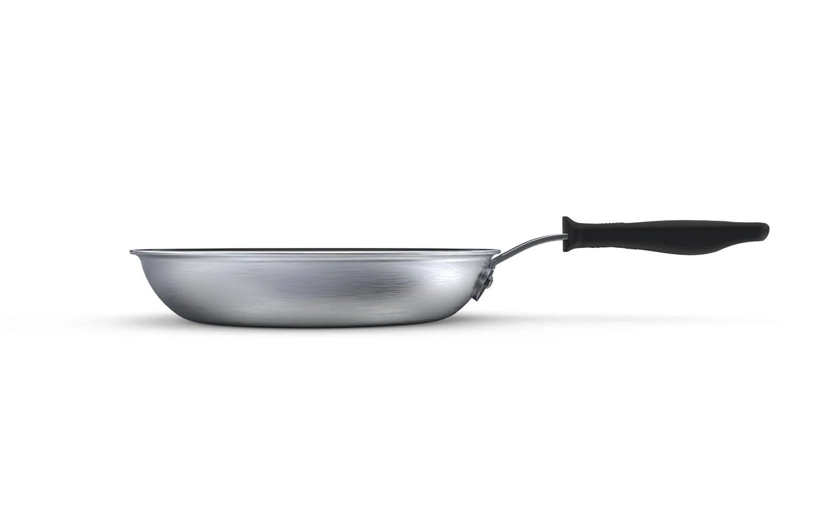 Side view of a shallow round fry pan with a silver-colored exterior and black handle