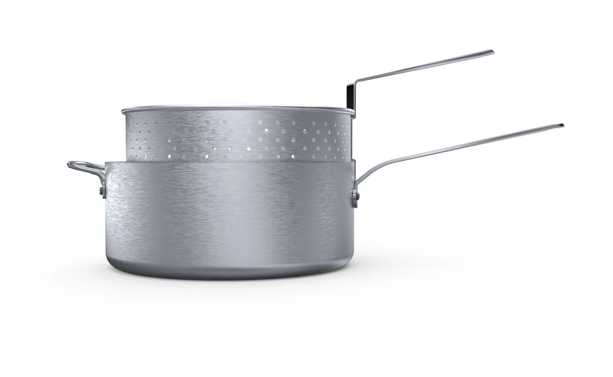 Side view of a silver-colored fryer pan with a perforated basket inside and long handles